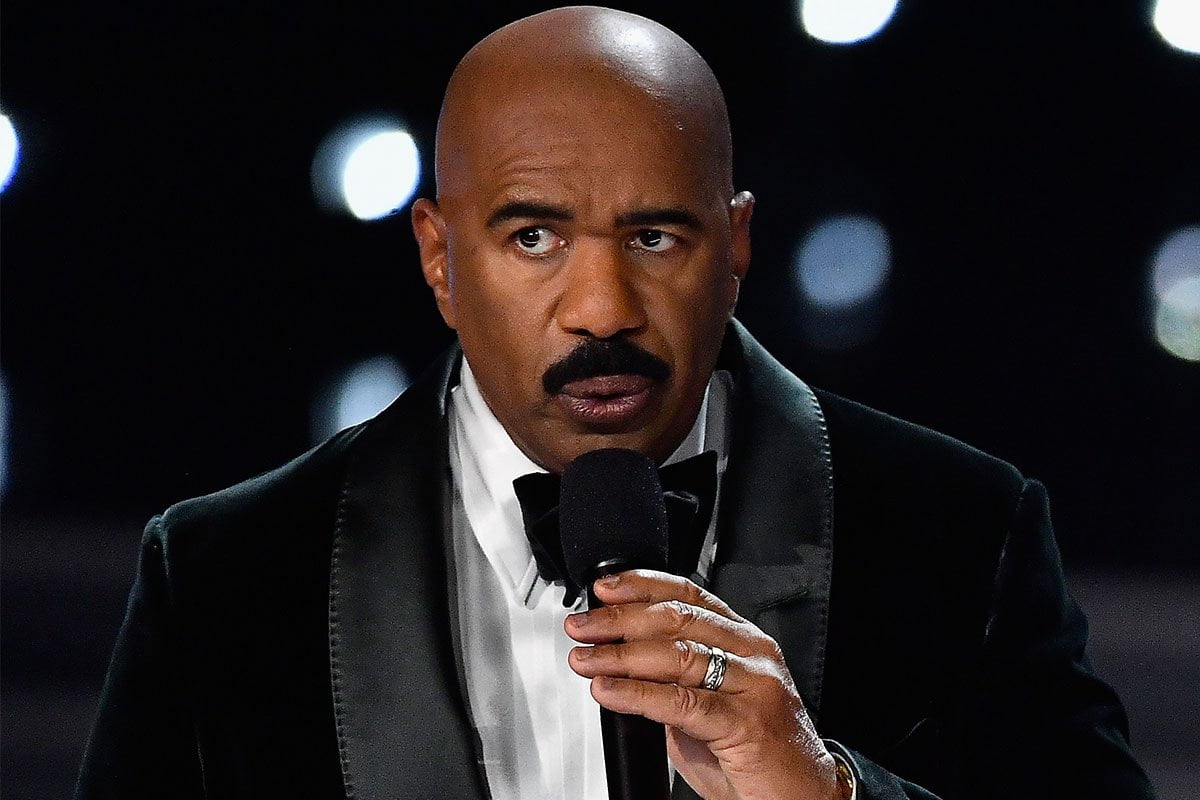 Steve Harvey making a questioning face with a great mustache. 